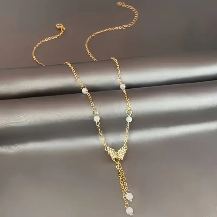 Zarif Kelebek Kolye ve İmitasyon İncilerle Şık Moda Takı